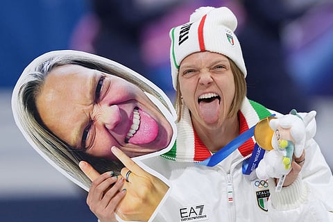 Arianna Fontana of Italy celebrates after Team Italy takes the gold medal in the team mixed relay short track speed skating at the 2026 Winter Olympics, in Milan, Italy.