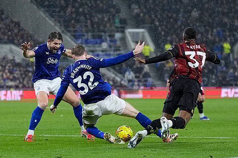 Bournemouth's Rayan, right, fouls Everton's Jarrad Branthwaite and gives away a penalty during their English Premier League soccer match in Liverpool, England.