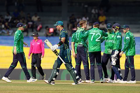 Australia's Glenn Maxwell leaves the ground after losing his wicket as Ireland's players celebrate during the T20 World Cup cricket match between Australia and Ireland in Colombo, Sri Lanka.