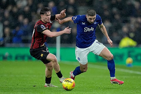 Bournemouth's Alex Toth, left, and Everton's Vitaliy Mykolenko battle for the ball during their English Premier League soccer match in Liverpool, England.
