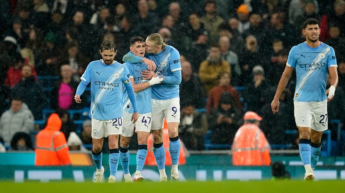 Manchester City's Erling Haaland, center, celebrates with teammates after scoring his side's third goal during the English Premier League soccer match between Manchester City and Fulham in Manchester, England, Wednesday, Feb. 11, 2026 - (AP Photo/Dave Thompson)
