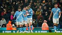 (AP Photo/Dave Thompson) : Manchester City's Erling Haaland, center, celebrates with teammates after scoring his side's third goal during the English Premier League soccer match between Manchester City and Fulham in Manchester, England, Wednesday, Feb. 11, 2026
