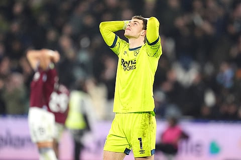 West Ham United goalkeeper Mads Hermansen reacts after a Premier League soccer match against Manchester United in London. 
