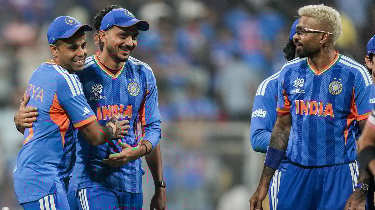 India's captain Suryakumar Yadav celebrates with teammates after their victory in the ICC T20 World Cup 2026 match against USA, at the Wankhede Stadium in Mumbai. - PTI
