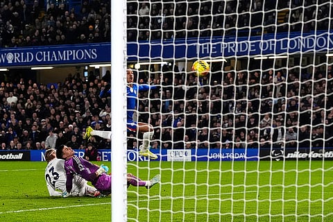 Chelsea's Joao Pedro scores their side's first goal of the game during their English Premier League soccer match in London.