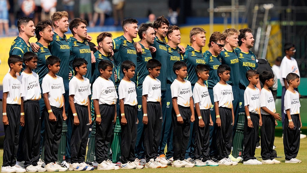 Australia's players line up for the national anthems before the start of the T20 World Cup match between Australia and Ireland in Colombo, Sri Lanka. - AP