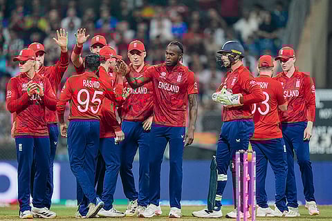 England's Adil Rashid celebrates with teammates after a DRS review for the wicket of West Indies' Roston Chase during an ICC Men's T20 World Cup 2026 cricket match between England and West Indies, at the Wankhede Stadium, in Mumbai, Maharashtra.