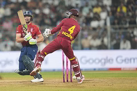 England's Jos Buttler plays a shot during the T20 World Cup cricket match between England and West Indies in Mumbai, India.