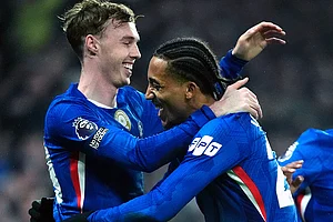 | Photo: Nick Potts/PA via AP : Chelsea's Cole Palmer, left, celebrates scoring their side's second goal of the game with team-mate Joao Pedro during an English Premier League soccer match against against Leeds United in London.