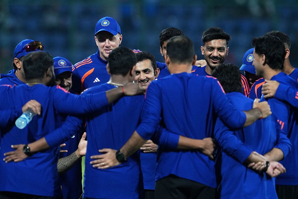 India's head coach Gautam Gambhir, center, smiles as he briefs the players before the start of the T20 World Cup cricket match between India and Namibia in New Delhi. - | Photo: AP/Manish Swarup