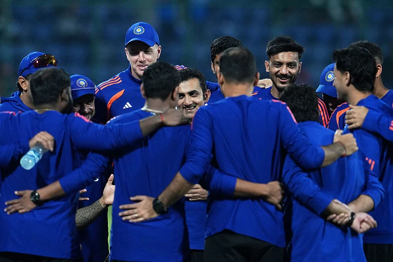 India's head coach Gautam Gambhir, center, smiles as he briefs the players before the start of the T20 World Cup cricket match between India and Namibia in New Delhi. - | Photo: AP/Manish Swarup