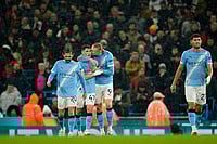 | Photo: AP/Dave Thompson : Manchester City's Erling Haaland, center, celebrates with teammates after scoring his side's third goal during the English Premier League soccer match between Manchester City and Fulham in Manchester, England.