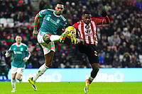 Sunderland 0-1 Liverpool, Premier League: Van Dijk Header Secures Huge Away Win For Reds | Photo: Owen Humphreys/PA via AP : Liverpool's Ryan Gravenberch, left, and Sunderland's Noah Sadiki battle for the ball during the English Premier League soccer match, in Sunderland, England.