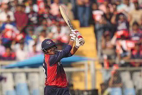 Nepal's Karan KC plays a shot during the T20 World Cup cricket match between Italy and Nepal in Mumbai, India.
