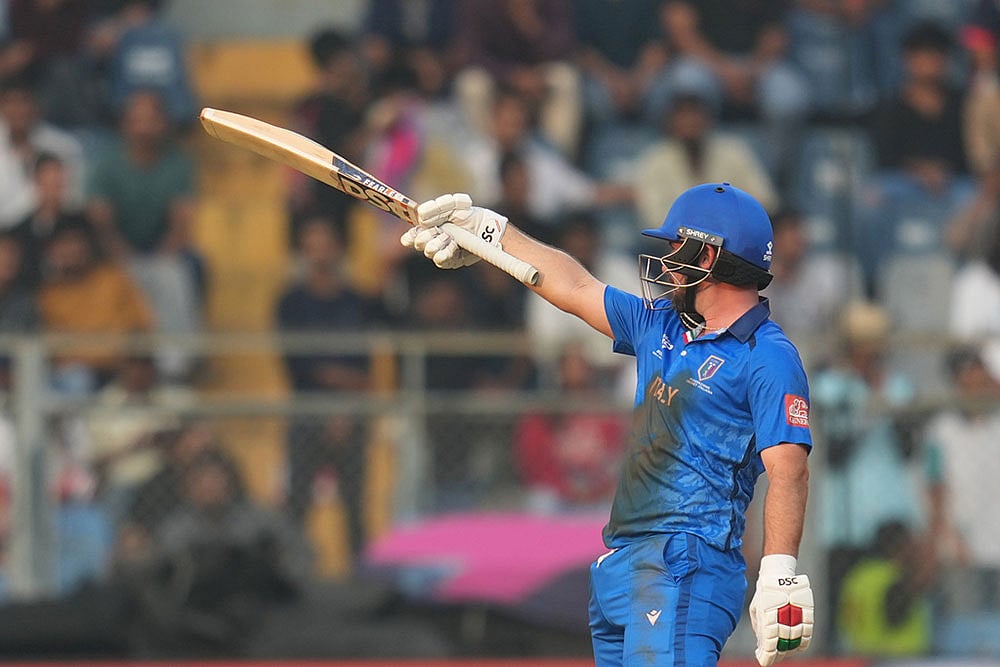 Italys Anthony Mosca celebrates his fifty runs