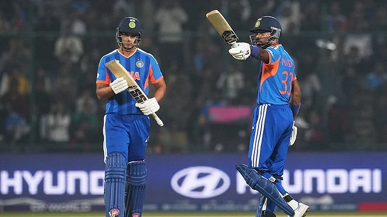 India's Shivam Dube applauds as batting partner Hardik Pandya celebrates his fifty runs during the T20 World Cup cricket match between India and Namibia in New Delhi. - | Photo: AP/Manish Swarup