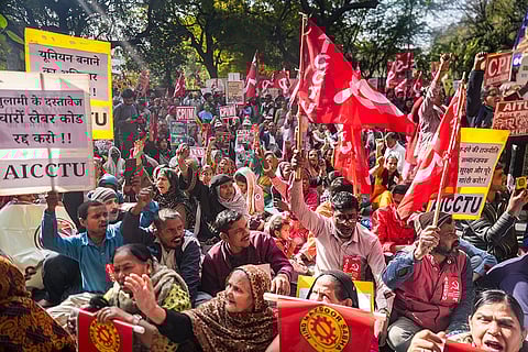 Farmers and members of various trade unions stage a protest during a nationwide strike called by a joint forum of central trade unions to demand the repeal of the four labour codes and the withdrawal of several government policies, at Jantar Mantar, in New Delhi.
