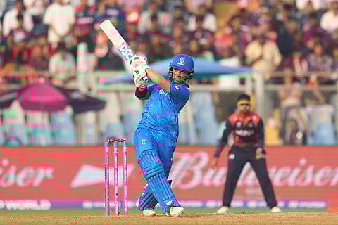 Italy's Justin Mosca hits a six during the T20 World Cup cricket match between Italy and Nepal in Mumbai, India.