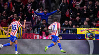 (AP Photo/Manu Fernandez) : Atletico Madrid's Antoine Griezmann, right, celebrates after scoring his side's second goal during the Copa del Rey semifinal first leg soccer match between Atletico Madrid and Barcelona in Madrid, Spain, Thursday, Feb. 12, 2026.