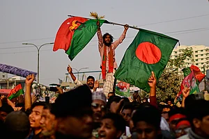 | Photo: AP/Mahmud Hossain Opu : Supporters of Bangladesh Nationalist Party (BNP) cheer during an election rally of their party Chairperson Tarique Rahman in Dhaka, Bangladesh.
