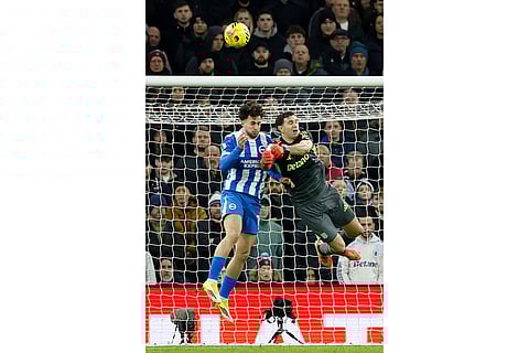 Aston Villa goalkeeper Emiliano Martinez clears the ball during their English Premier League soccer match against Brighton in Birmingham, England.