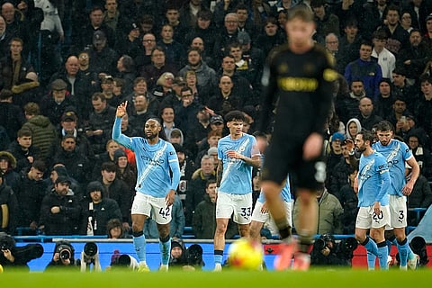 Manchester City's Antoine Semenyo, left, celebrates after scoring the opening goal during the English Premier League soccer match between Manchester City and Fulham in Manchester, England.