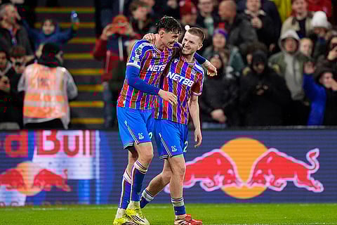 Crystal Palace's Jorgen Strand Larsen, left, celebrates with his teammate after scoring their side's second goal of the game during the English Premier League soccer match against Burnley, in London.