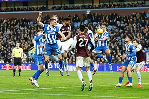 | Photo: Cody Froggatt/PA via AP : Aston Villa's Tyrone Mings scores their side's first goal of the game during their English Premier League soccer match against Brighton in Birmingham, England.