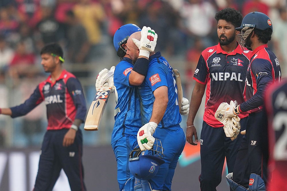 Italy's Justin Mosca, left, Anthony Mosca celebrates after won the T20 World Cup cricket match against the Nepal in Mumbai, India. - Photo: AP/Rafiq Maqbool