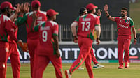 | Photo: AP/Eranga Jayawardena : Oman's Sufyan Mehmood, right, celebrates with teammates the wicket of Zimbabwe's Tadiwanashe Marumani during the T20 World Cup cricket match between Oman and Zimbabwe in Colombo, Sri Lanka, Monday, Feb. 9, 2026.