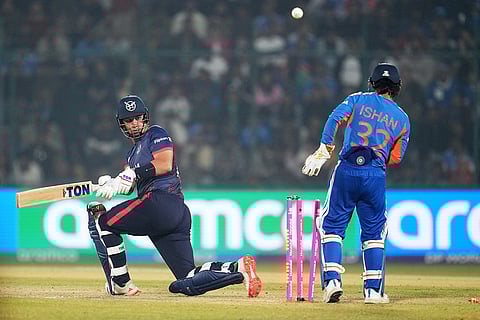 Namibia's JJ Smit is bowled out by India's Varun Chakravarthy during the T20 World Cup cricket match between India and Namibia in New Delhi.
