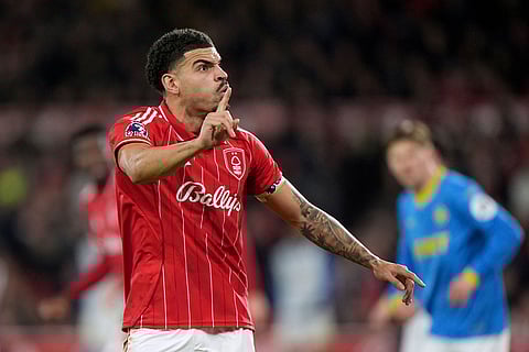 Nottingham Forest's Morgan Gibbs-White reacts and asks the fans not to boo teammate Omari Hutchinson during the English Premier League soccer match between Nottingham Forest and Wolverhampton Wanderers, in Nottingham, England.