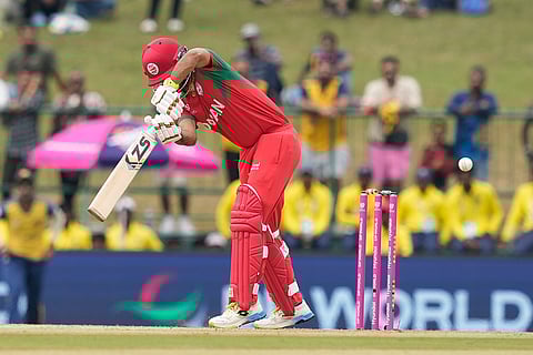 Oman's Captain Jatinder Singh bowled out by Sri Lanka's Dushmantha Chameera during the T20 World Cup cricket match between Oman and Sri Lanka in Pallekele, Sri Lanka.