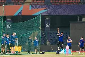 | Photo: PTI/Salman Ali : India's Jasprit Bumrah bowls a delivery during a practice session ahead of an ICC Men's T20 World Cup 2026 cricket match between India and Namibia, at the Arun Jaitley Stadium, in New Delhi. BCCI selection committee Chairman Ajit Agarkar, the team’s head coach Gautam Gambhir, bowling coach Morne Morkel and players Rinku Singh and Kuldeep Yadav are also seen.