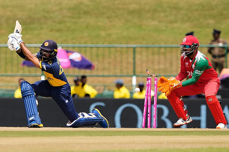 Sri Lanka's Kamil Mishara bowled out by Oman's Jay Odedra during the T20 World Cup cricket match between Oman and Sri Lanka in Pallekele, Sri Lanka. - | Photo: AP/Eranga Jayawardena