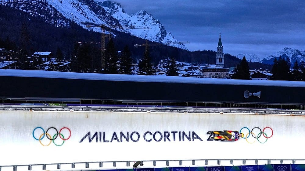 Germany's Anna Berreiter slides down the track during a women's single luge run at the 2026 Winter Olympics, in Cortina d'Ampezzo, Italy. - Photo: AP/Alessandra Tarantino