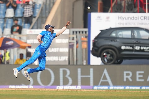 Italy's Crishan Kalugamage jumps unsuccessfully to take a catch during the T20 World Cup cricket match between Italy and Nepal in Mumbai, India.