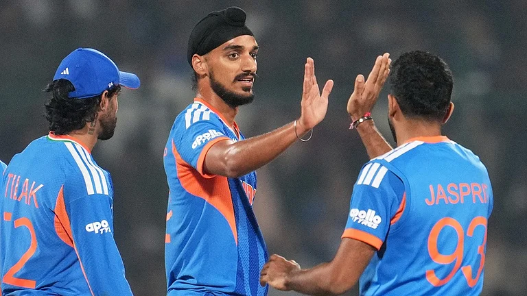 India's Arshdeep Singh, centre, celebrates with teammate Jasprit Bumrah the wicket of Namibia's Jan Frylinck during the T20 World Cup match between India and Namibia in New Delhi. - Photo: AP