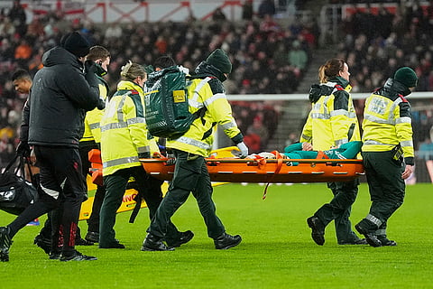 Liverpool's Wataru Endo leaves the game on a stretcher after an injury during the English Premier League soccer match against Sunderland, in Sunderland, England.