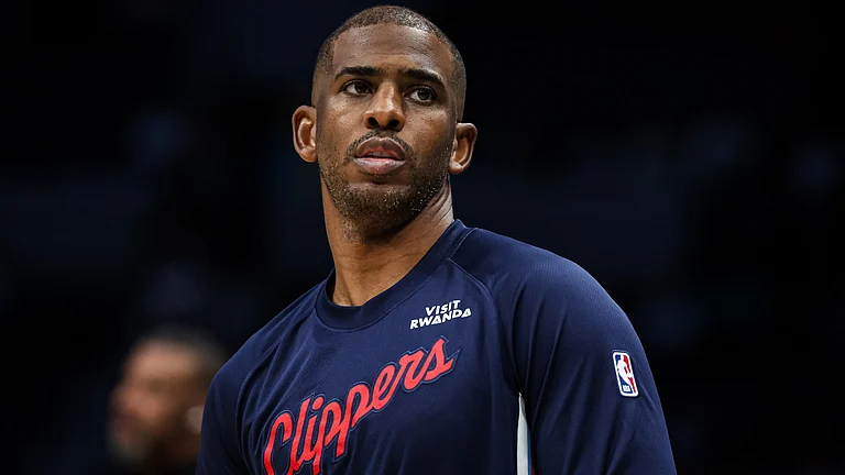 Chris Paul #3 of the LA Clippers warms up before a basketball game against the Charlotte Hornets at Spectrum Center on November 22, 2025 in Charlotte, North Carolina. - Opta