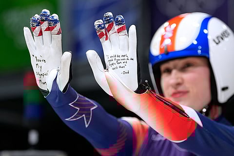 United States' Sophia Kirkby poses during the luge relay competition at the 2026 Winter Olympics, in Cortina d'Ampezzo, Italy.