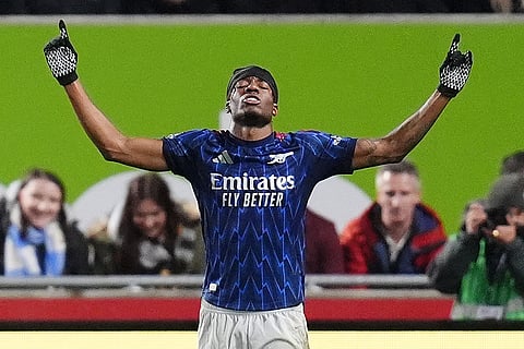Arsenal's Noni Madueke celebrates scoring their side's first goal during the English Premier League soccer match between Brentford and Arsenal in London.