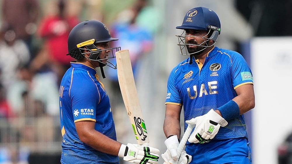 United Arab Emirates' Alishan Sharafu, left, celebrates as United Arab Emirates' captain Muhammad Waseem looks on his fifty runs during the T20 World Cup cricket match between New Zealand and United Arab Emirates in Chennai. - Photo: AP/Mahesh Kumar A.