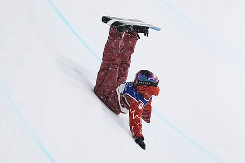 Canada's Elizabeth Hosking crashes during the women's snowboarding halfpipe finals at the 2026 Winter Olympics, in Livigno, Italy.
