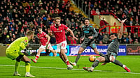 Wrexham Vs Ipswich Town Highlights, FA Cup 2025-26 Fourth Round: Windass’ Strike Seals Red Dragons’ Win (Martin Rickett/PA via AP) : Ipswich Town's Jacob Greaves, right, blocks a cross as Wrexham's Sam Smith (28) looks on during an English FA Cup fourth round soccer, Friday, Feb. 13, 2026, in Wrexham, Wales.