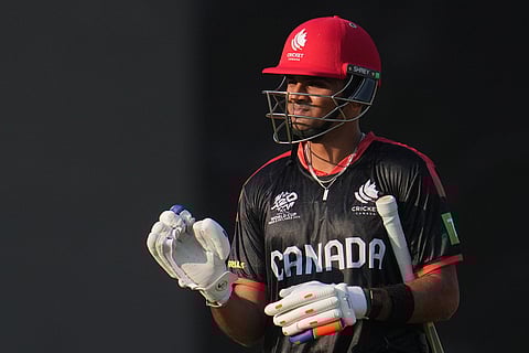 Canada's Harsh Thaker leaves the ground after losing his wicket during the T20 World Cup cricket match between Canada and United Arab Emirates in New Delhi.
