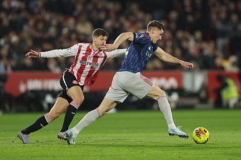 Brentford's Mikkel Damsgaard guards Arsenal's Viktor Gyoekeres during the English Premier League soccer match between Brentford and Arsenal in London.