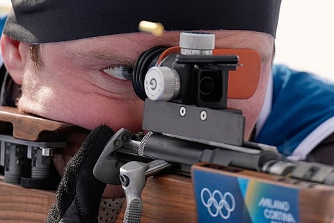 Lucas Fratzscher, of Germany, participates in a biathlon training session at the 2026 Winter Olympics in Anterselva, Italy.