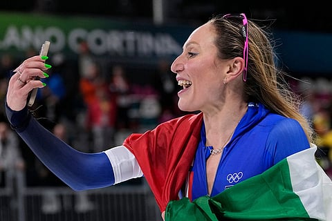 Francesca Lollobrigida of Italy celebrates winning the gold medal in the women's 5,000 meters speedskating race at the 2026 Winter Olympics, in Milan, Italy.