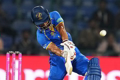 United Arab Emirates' Sohaib Khan hits a six during the T20 World Cup cricket match between Canada and United Arab Emirates in New Delhi.